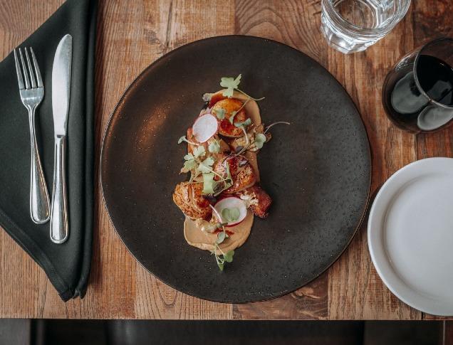 A table set with food and wine at Abruzzi Ristorante.
