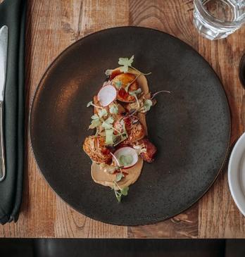 A table set with food and wine at Abruzzi Ristorante.