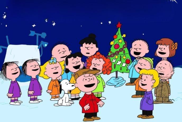 Charlie Brown directs the Peanuts gang as they sing around a scrawny Christmas tree on a snowy night.