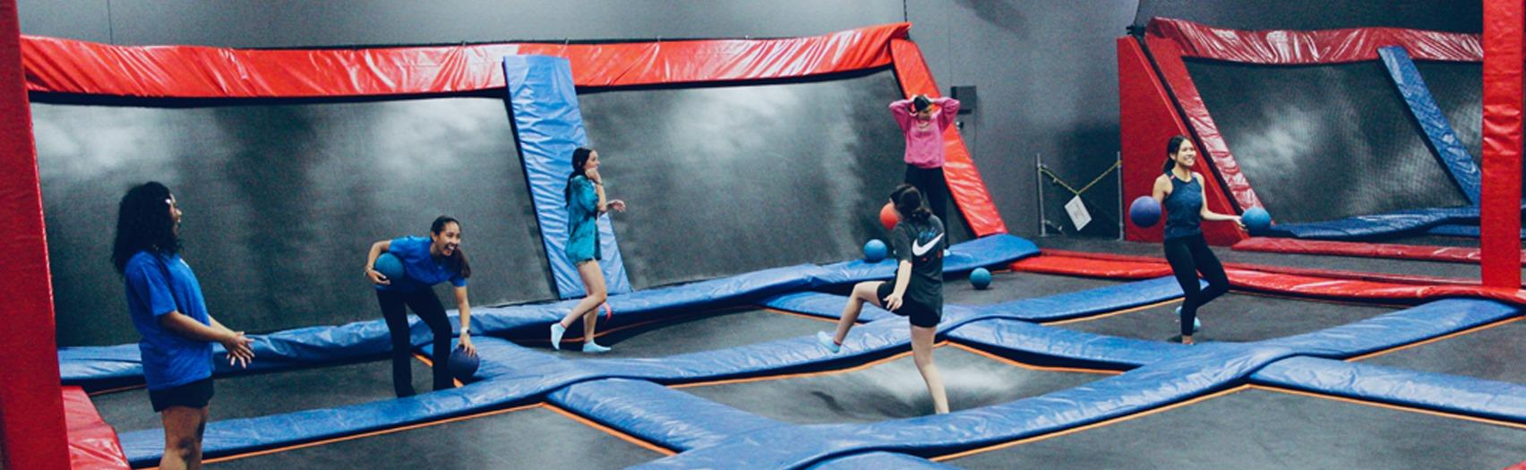 Aerosports Trampoline Park - people jumping on trampolines.