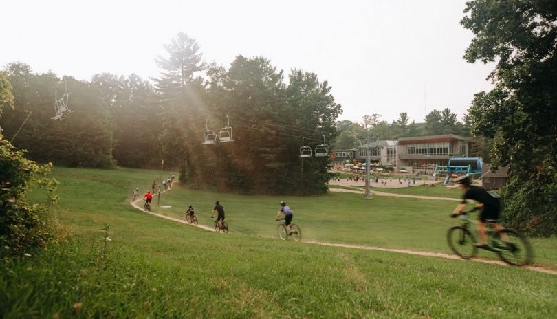 Several mountain bikers on a trail at Boler Mountain in London, Ontario.