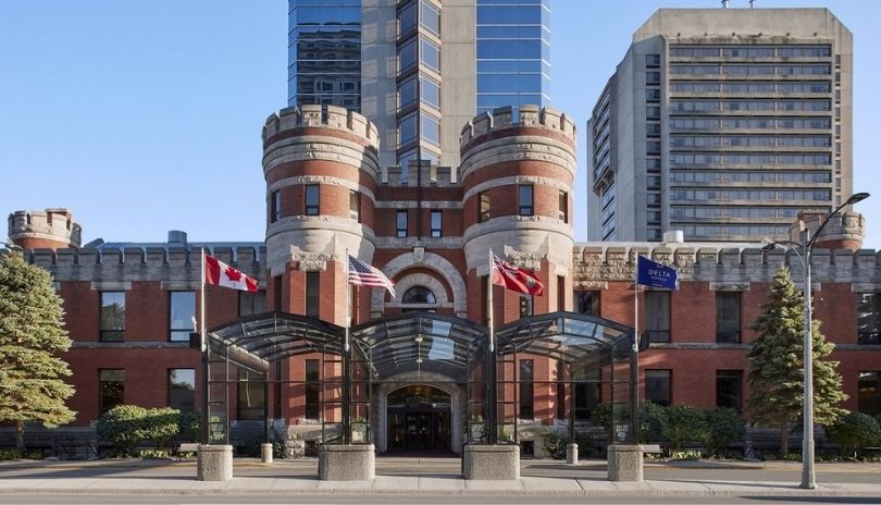 Exterior of Delta Hotels by Marriott London Armouries, a historic red building in downtown London, Ontario.