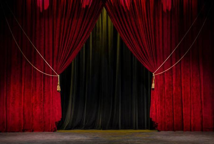 A white outline of a family with two adults and three children on a maroon background.