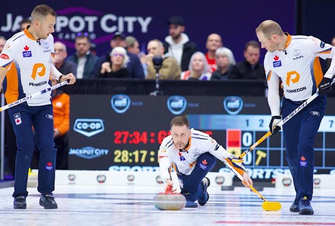 Team Gushue curling at a 2024 Grand Slam of Curling event