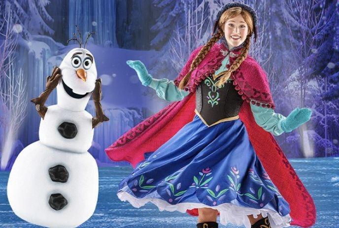 Olaf smiles beside Anna in a snowy forest; Frozen magic glows in icy trees and waterfall behind them.