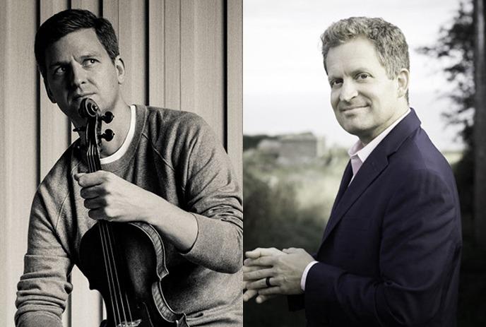 A violinist artist holding his instrument and bow, while another artist in a suite standing and smiling for a picture.