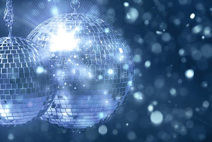 Bright disco balls shimmering against a blue and white background.
