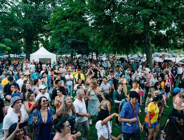 A large group of people gathered for an outdoor festival in London, Ontario