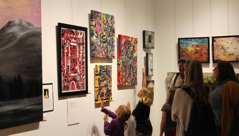 People checking the art at Tap Centre of Creativity.