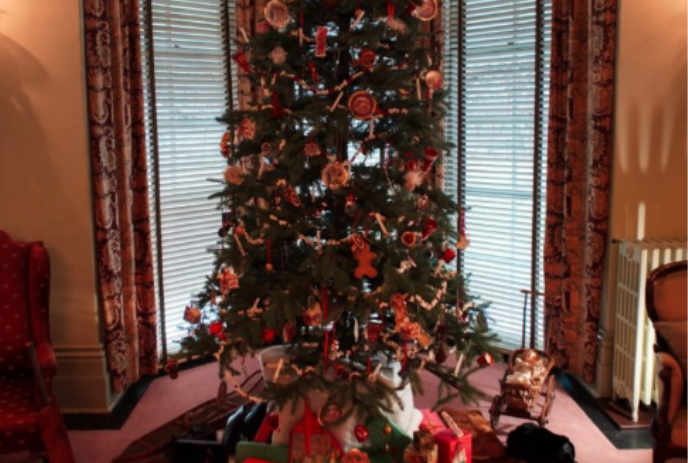 Victorian Christmas tree with presents underneath.
